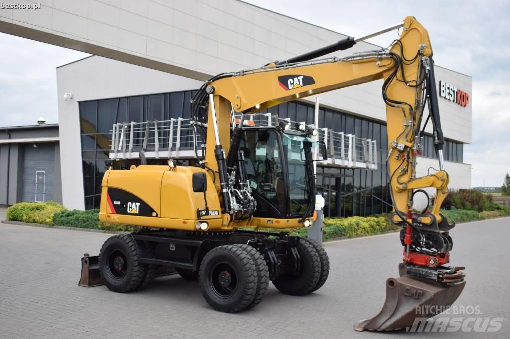 CAT M 313 D حفارات بعجل