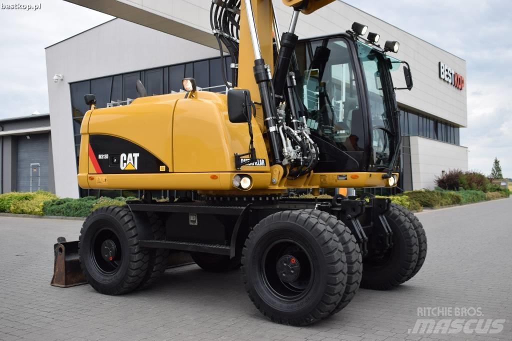 CAT M 313 D حفارات بعجل