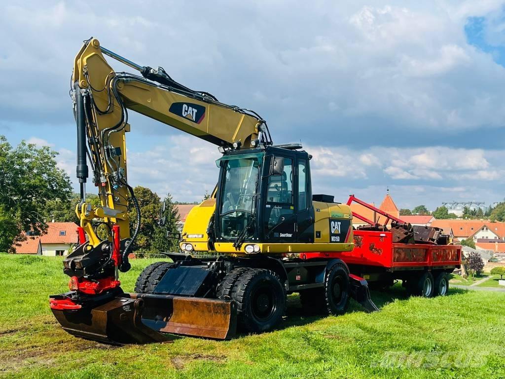 CAT M 315 D حفارات بعجل