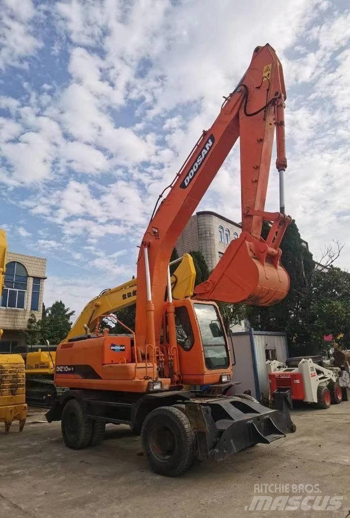 Doosan DH 210 W-7 حفارات بعجل