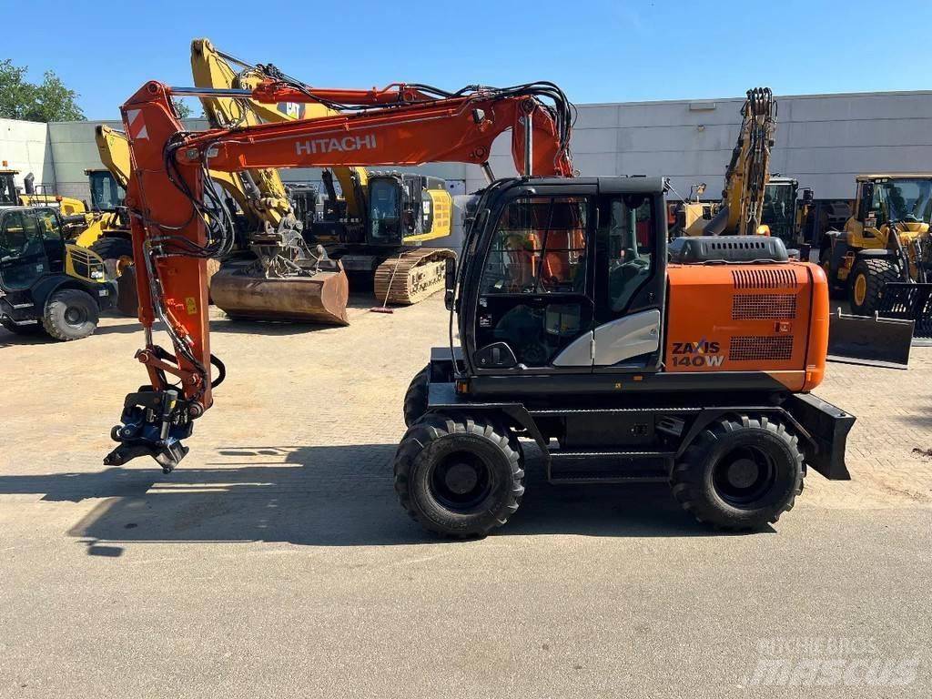 Hitachi 140W حفارات بعجل