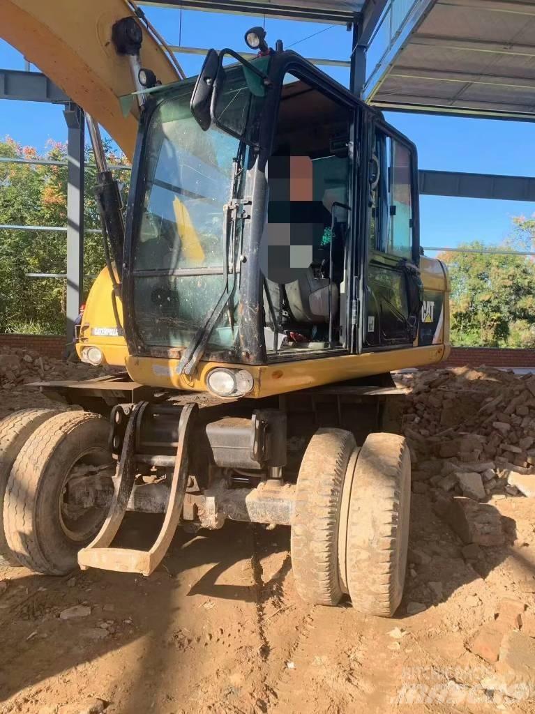 CAT 315 D حفارات بعجل