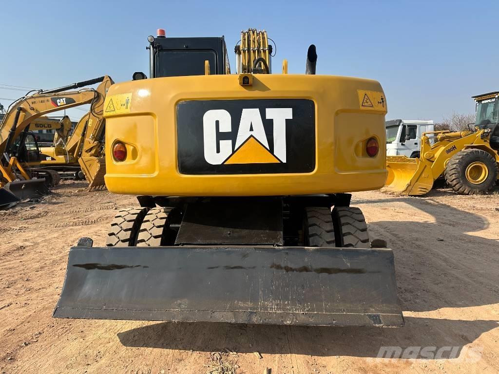CAT M 320D حفارات بعجل