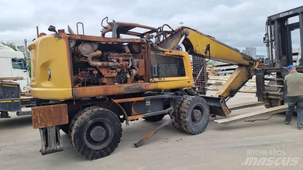 CAT M 316 F حفارات بعجل