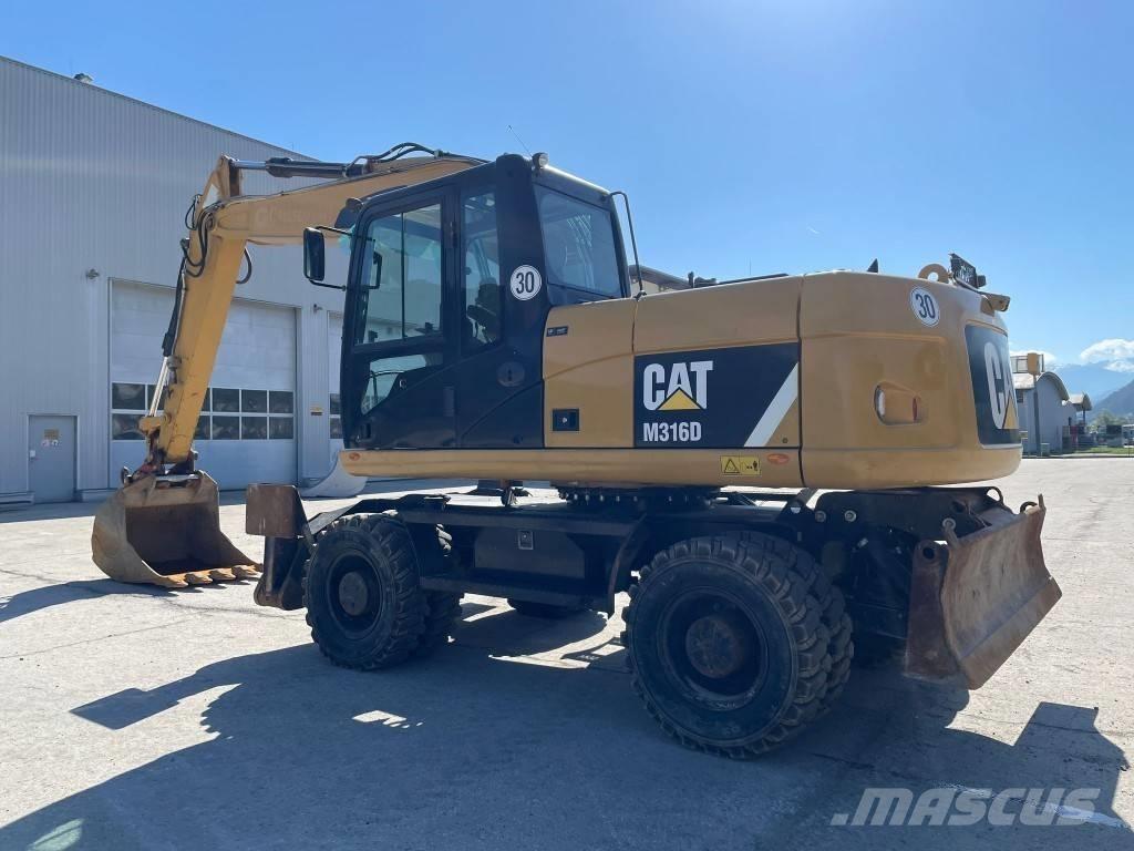 CAT M 316 D حفارات بعجل