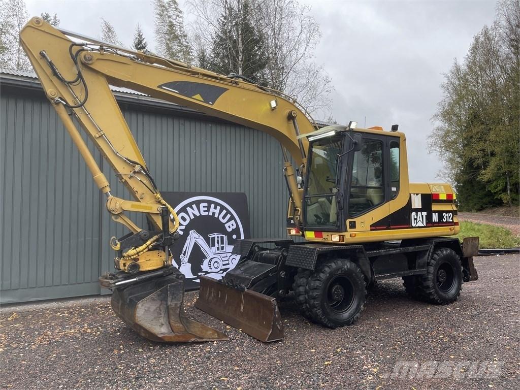 CAT M 312 حفارات بعجل
