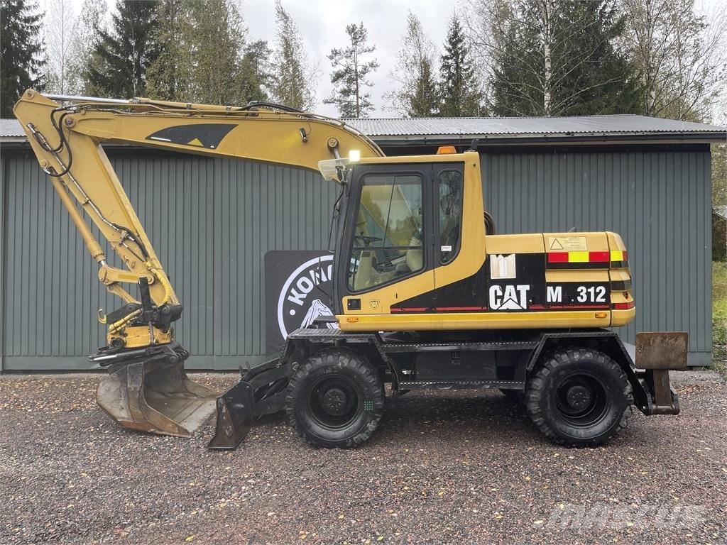 CAT M 312 حفارات بعجل