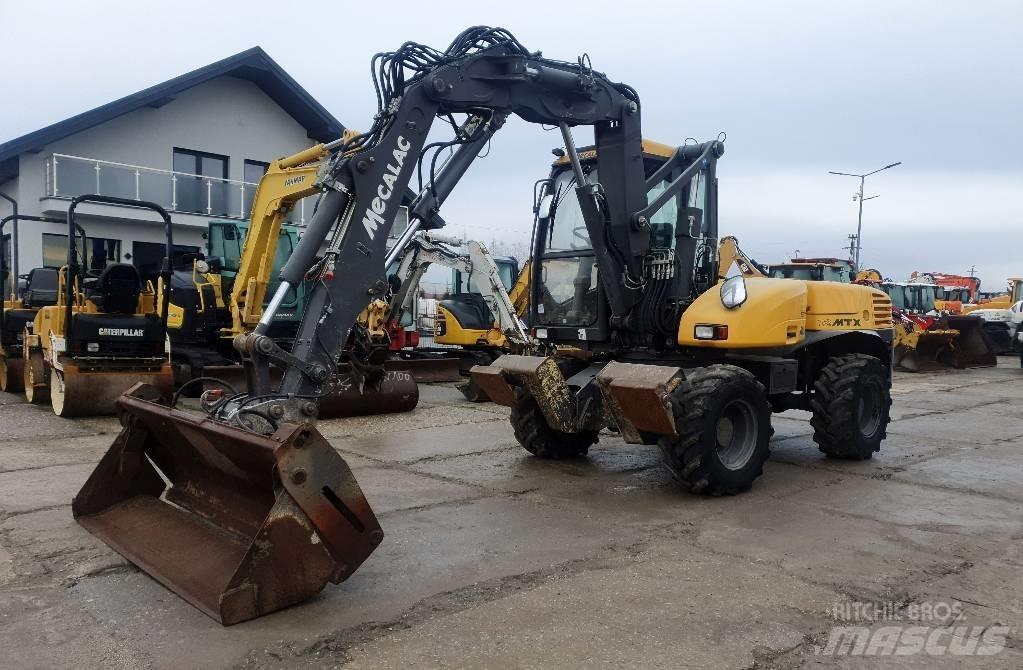 Mecalac 12 M TX حفارات بعجل