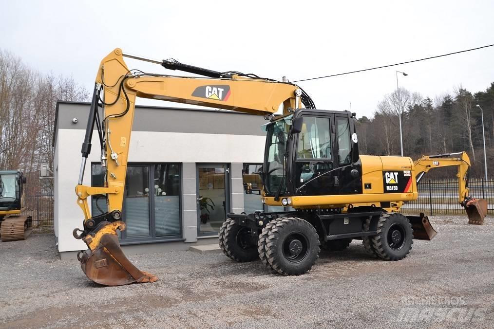 CAT M 315 D حفارات بعجل