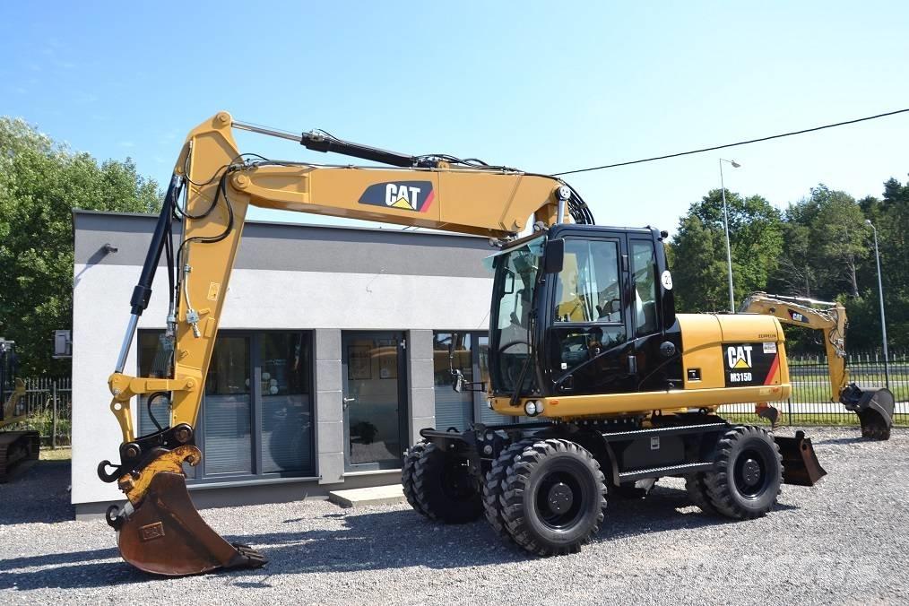 CAT M 315 D حفارات بعجل