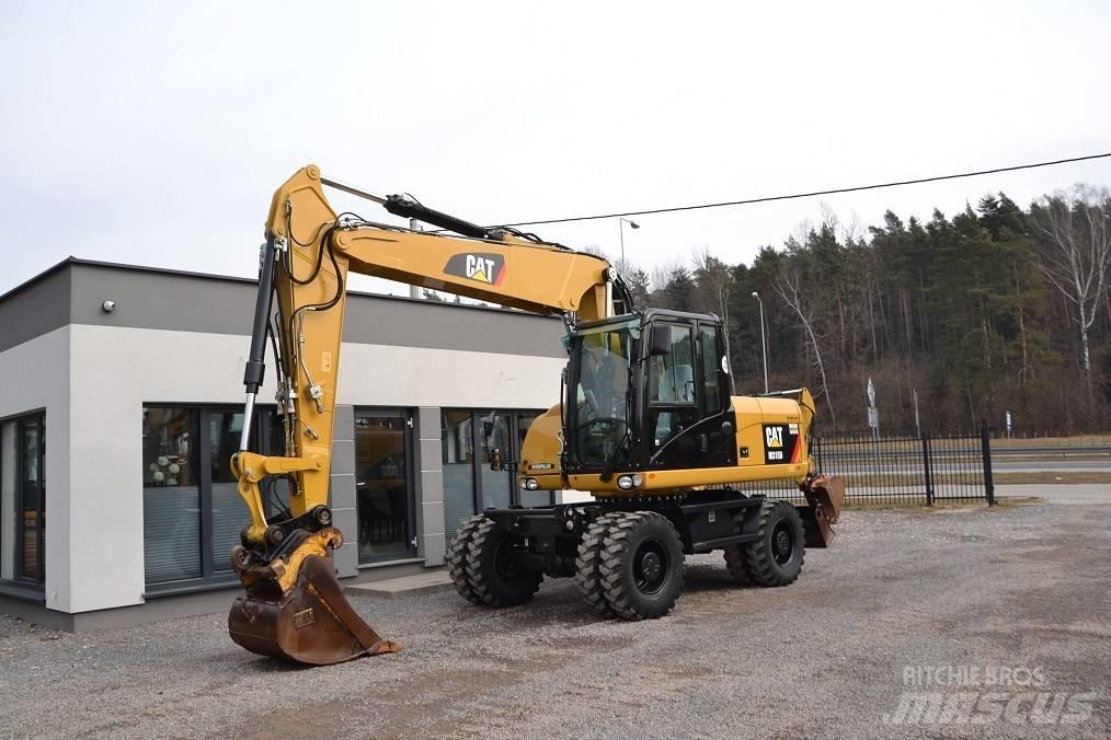CAT M 315 D حفارات بعجل