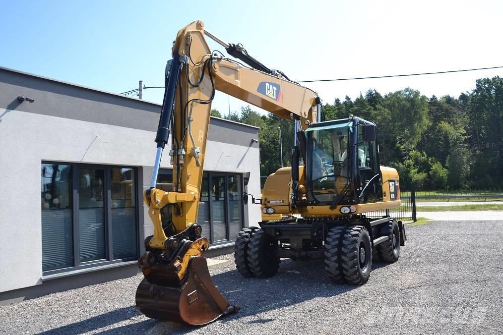 CAT M 315 D حفارات بعجل