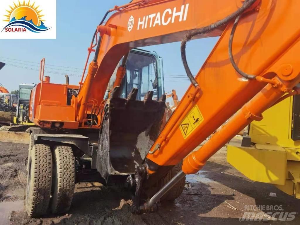 Hitachi EX 100 W D حفارات بعجل
