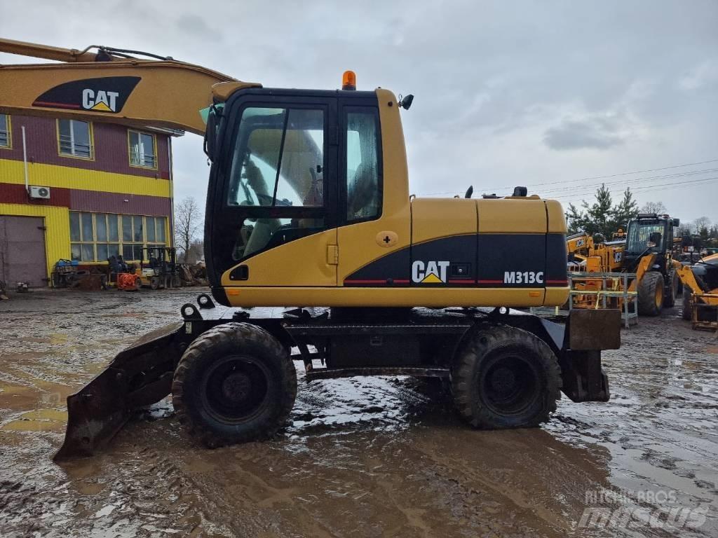 CAT M 313 C حفارات بعجل