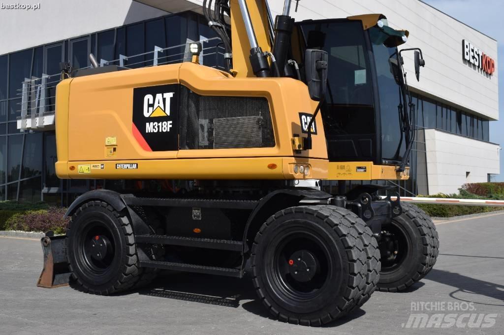 CAT M 318 F حفارات بعجل
