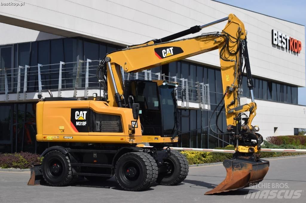 CAT M 318 F حفارات بعجل