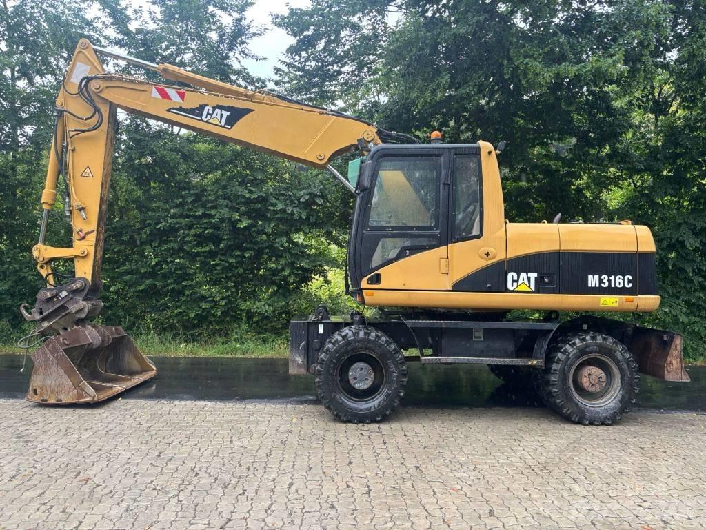 CAT M 316 C حفارات بعجل