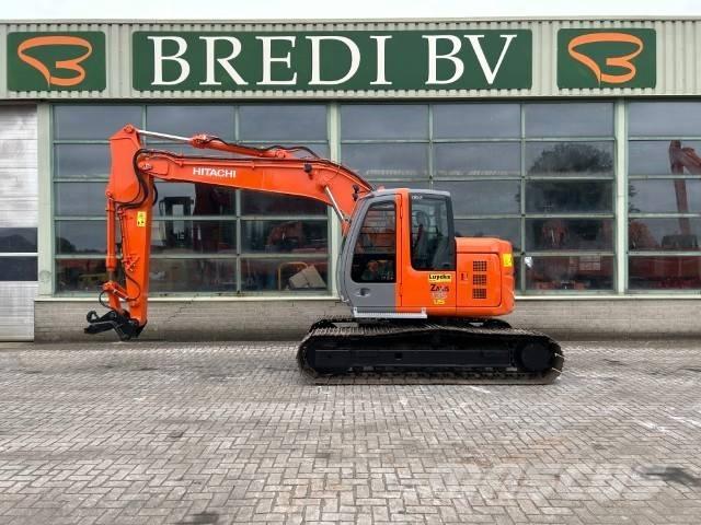 Hitachi ZX 135 US حفارات زحافة
