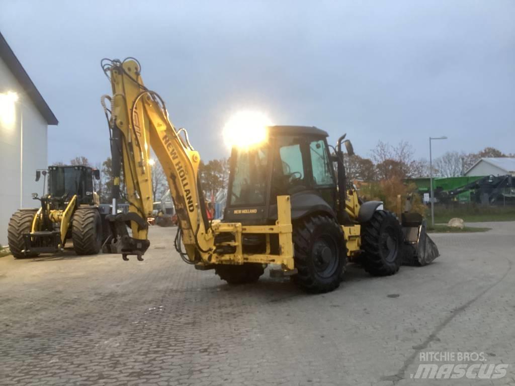 New Holland B 115 C لوادر ذات جرافات عكسية