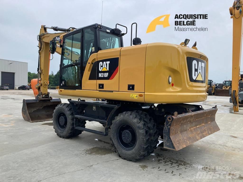 CAT M318F حفارات بعجل