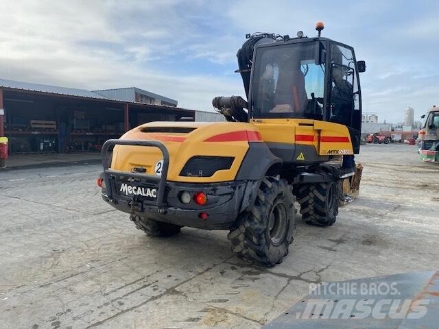 Mecalac 12 M TX حفارات بعجل