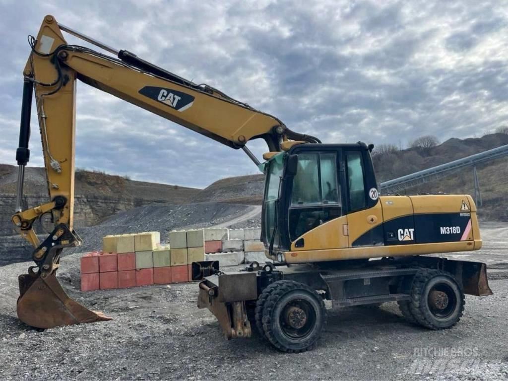 CAT M318D حفارات بعجل