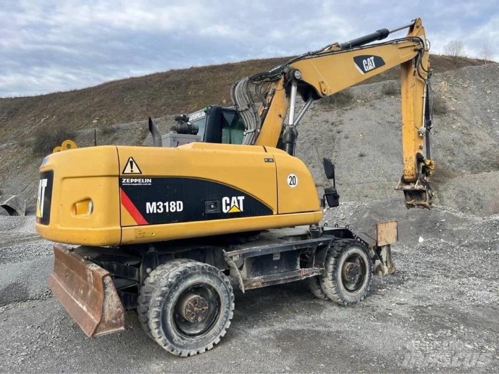 CAT M318D حفارات بعجل