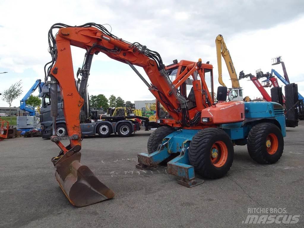 Mecalac 12MXT حفارات بعجل
