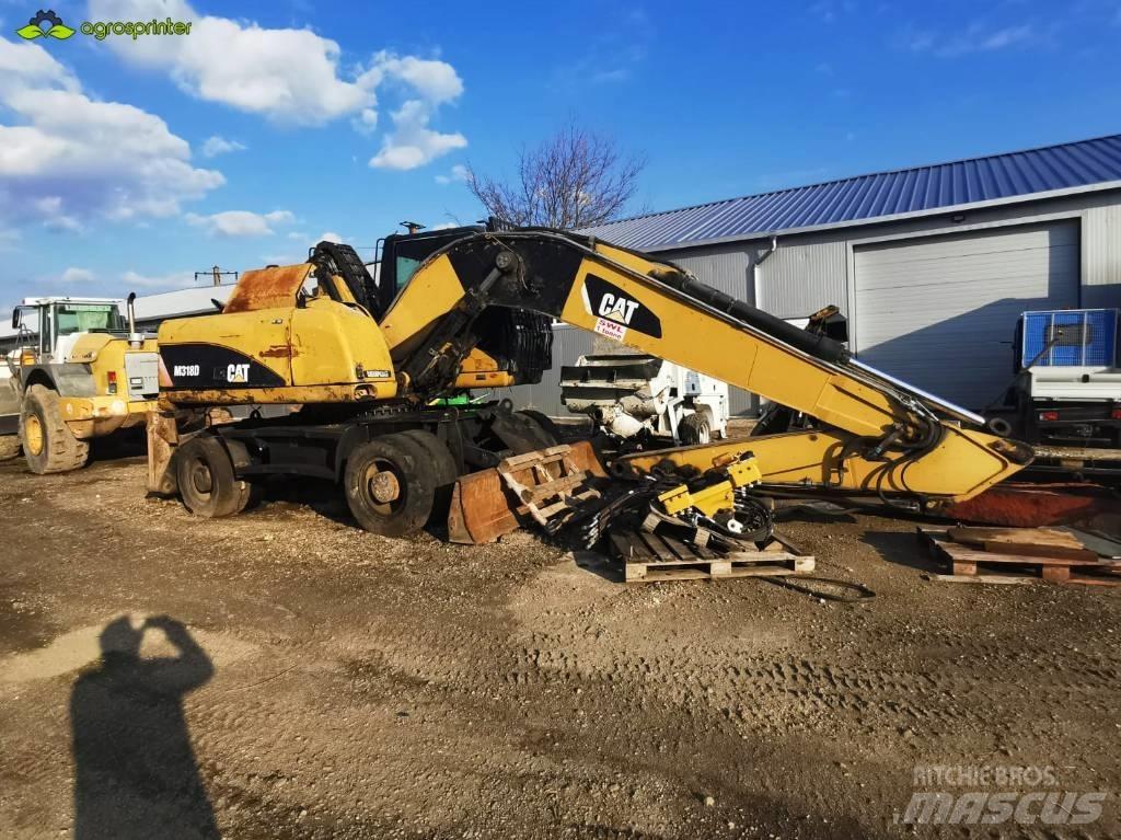 CAT M 318 D مناولات المخلفات / مناولات صناعية