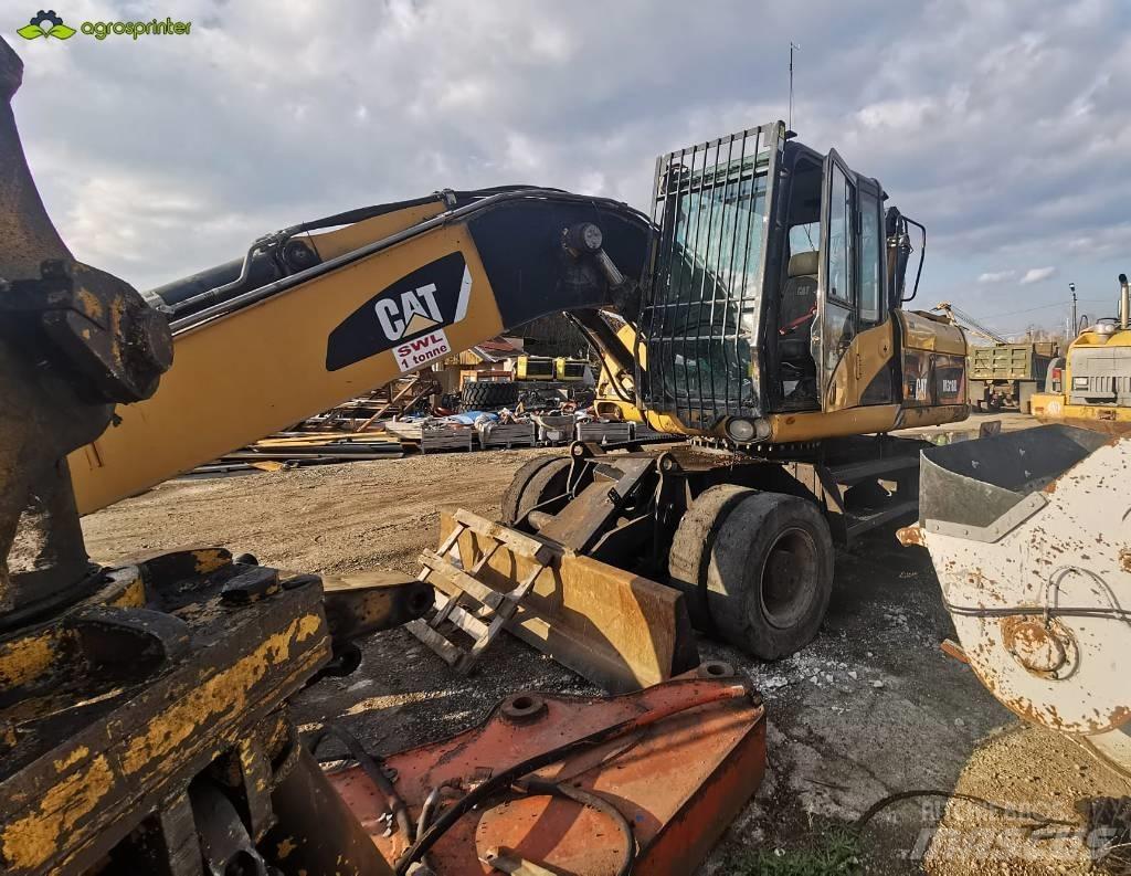 CAT M 318 D مناولات المخلفات / مناولات صناعية