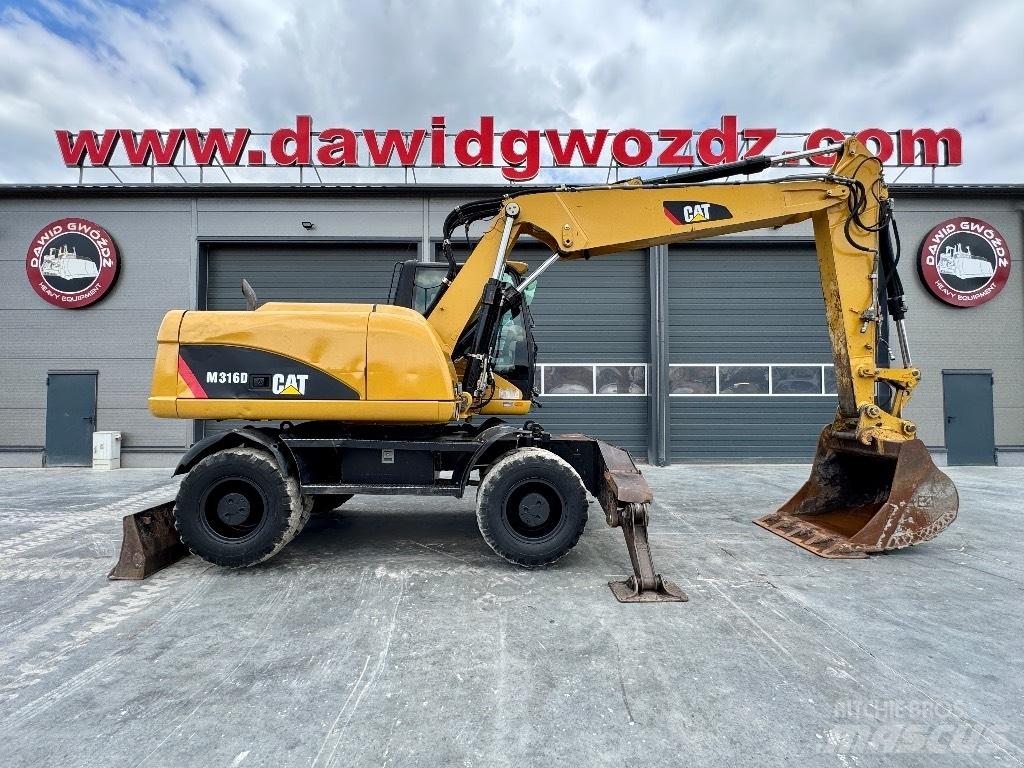 CAT M 316 D حفارات بعجل