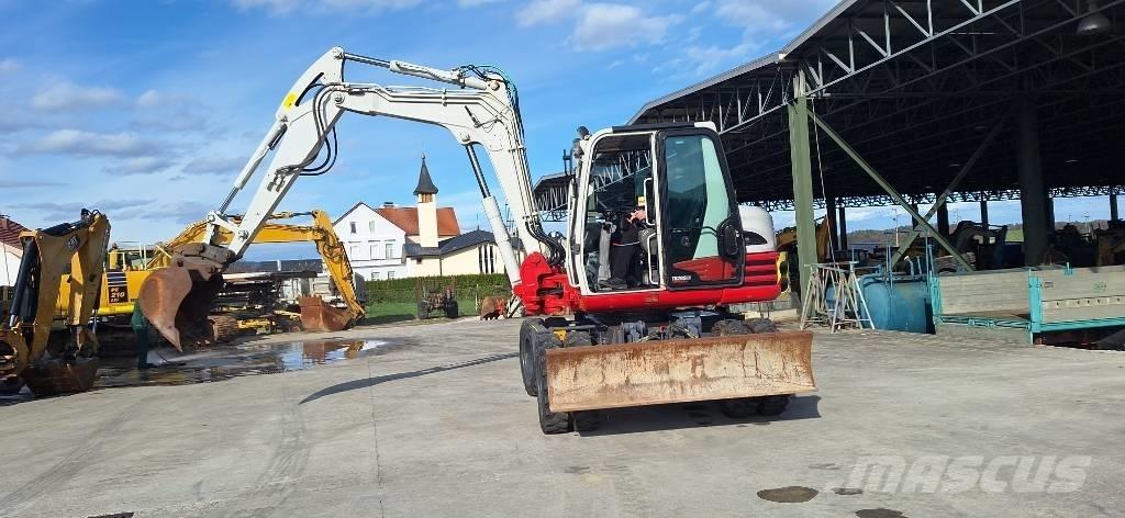 Takeuchi TB 295 W حفارات بعجل