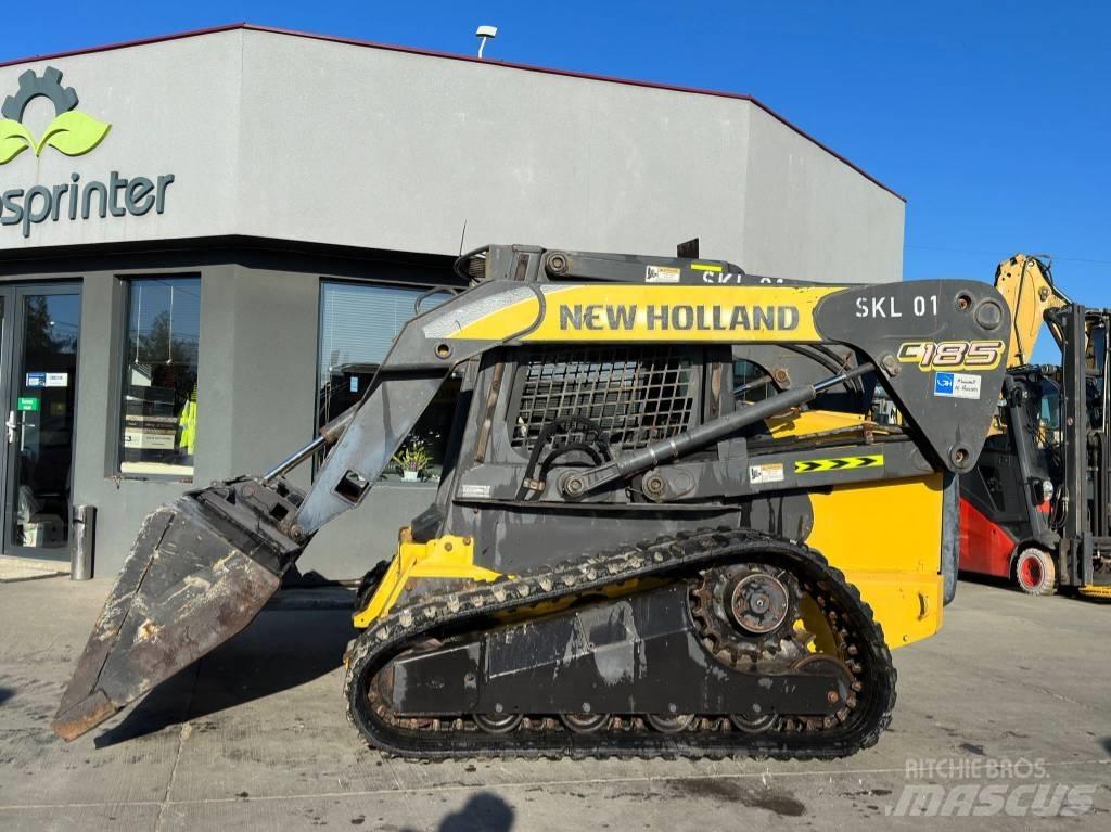 New Holland C 185 لوادر انزلاقية التوجيه