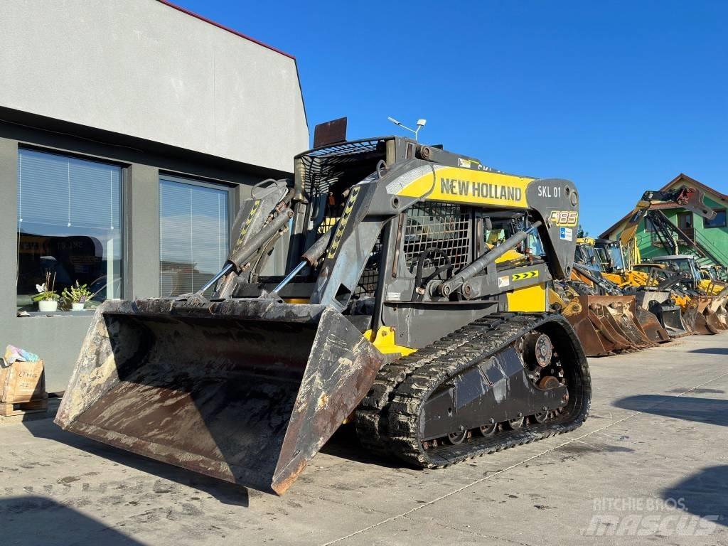 New Holland C 185 لوادر انزلاقية التوجيه
