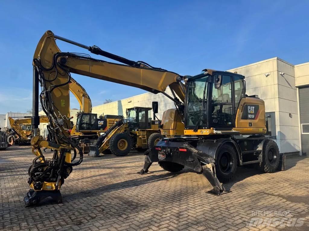 CAT M315F حفارات بعجل