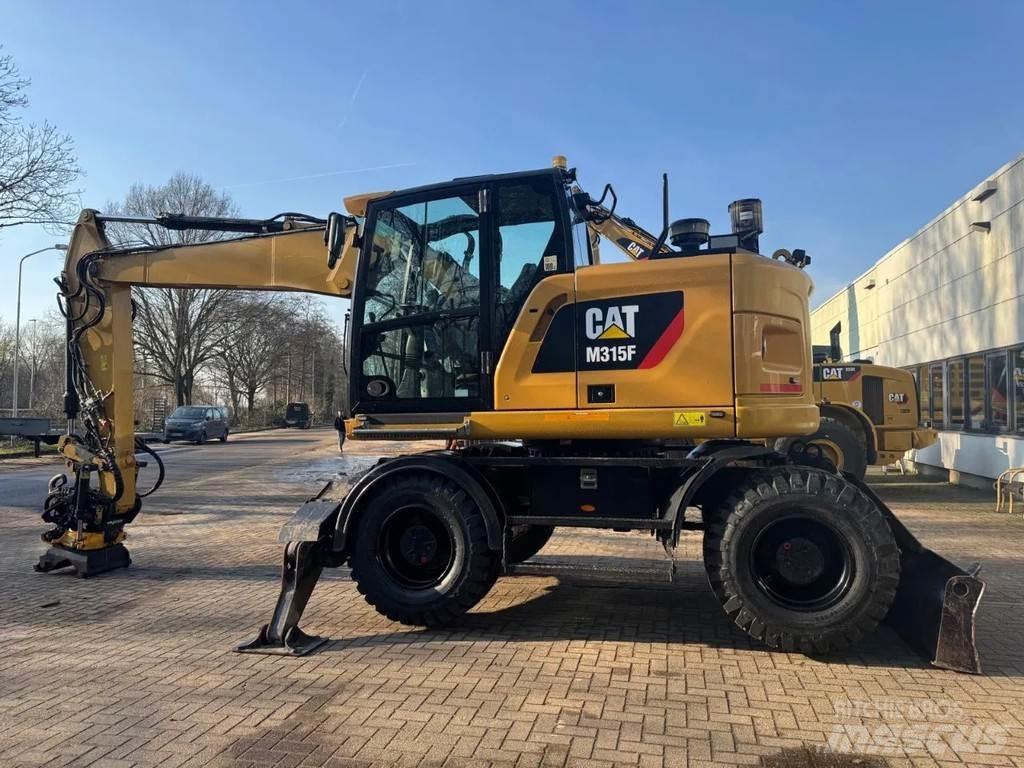 CAT M315F حفارات بعجل