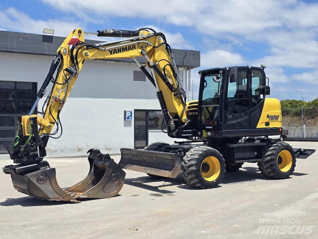 Yanmar B 110 W حفارات بعجل