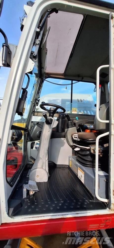 Takeuchi TB 295W حفارات بعجل