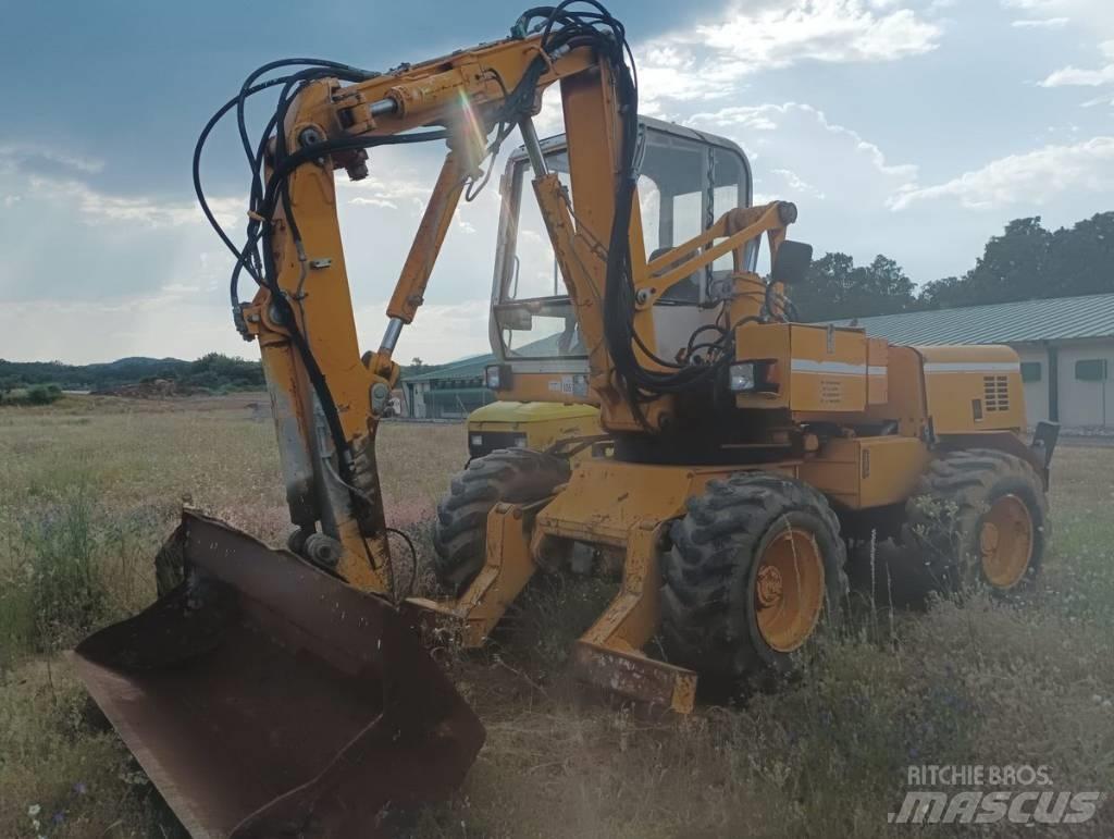 Mecalac 11 CX حفارات بعجل