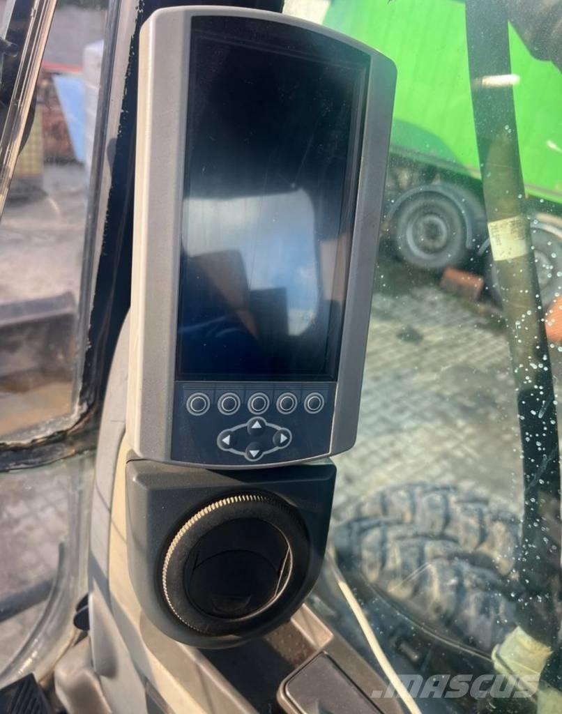 CAT M313D حفارات بعجل