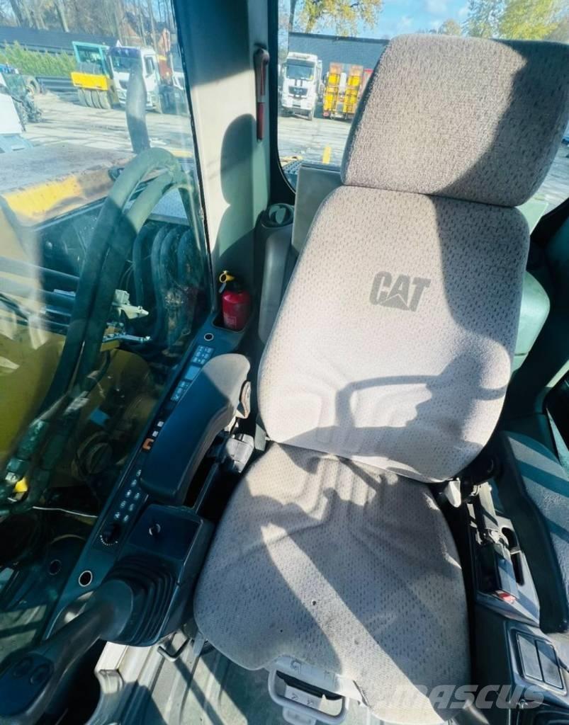 CAT M313D حفارات بعجل