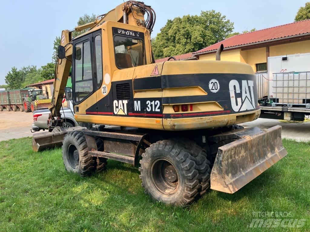 CAT M 312 حفارات بعجل