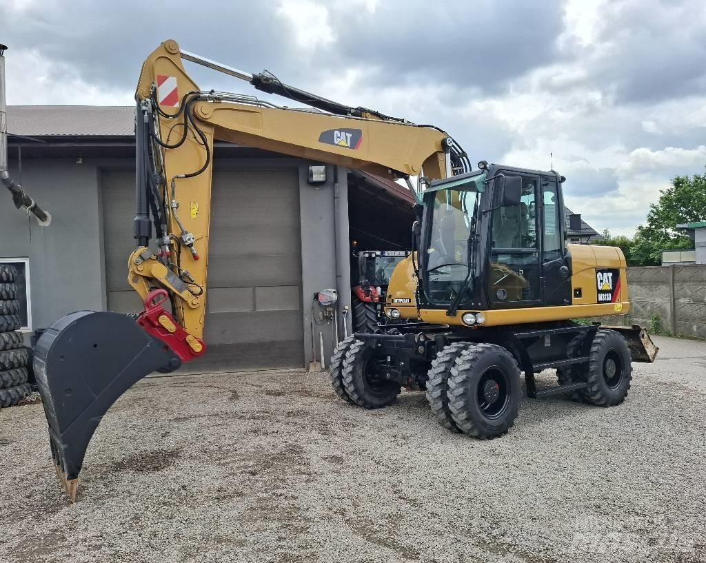 CAT 313 D حفارات بعجل