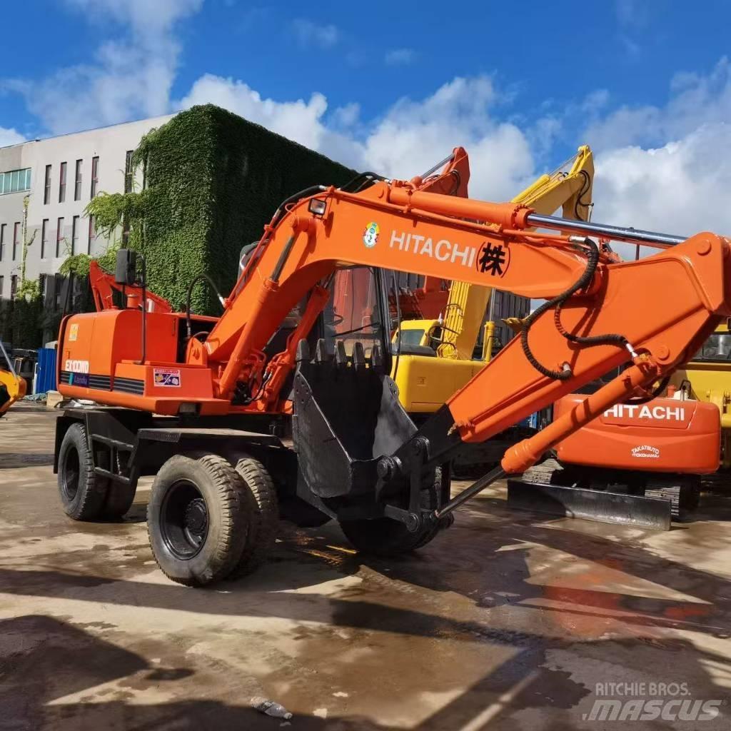 Hitachi EX 100 W D حفارات بعجل