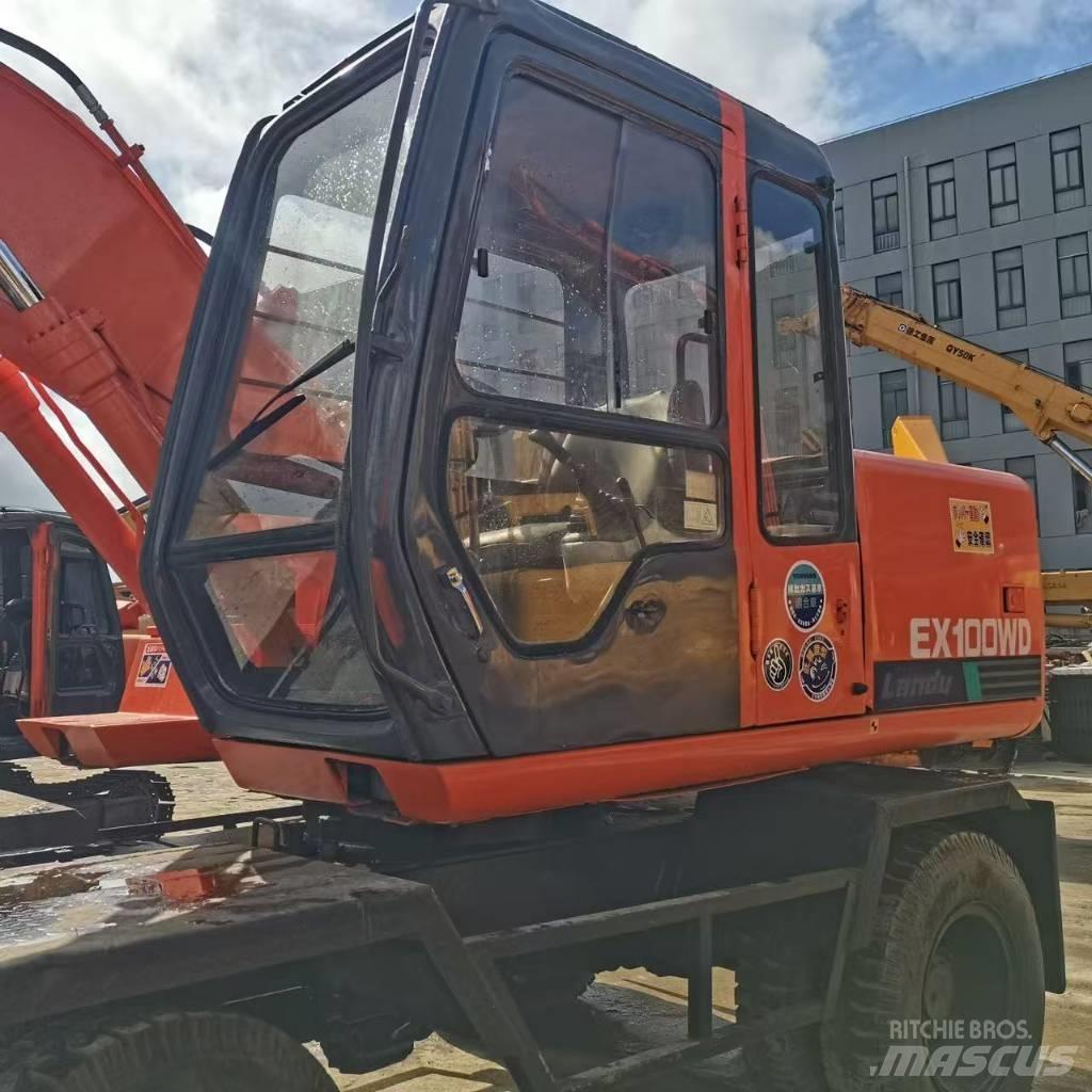 Hitachi EX 100 W D حفارات بعجل