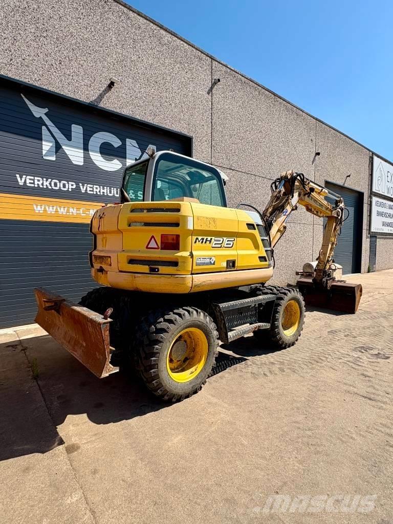 New Holland MH 2.6 حفارات بعجل