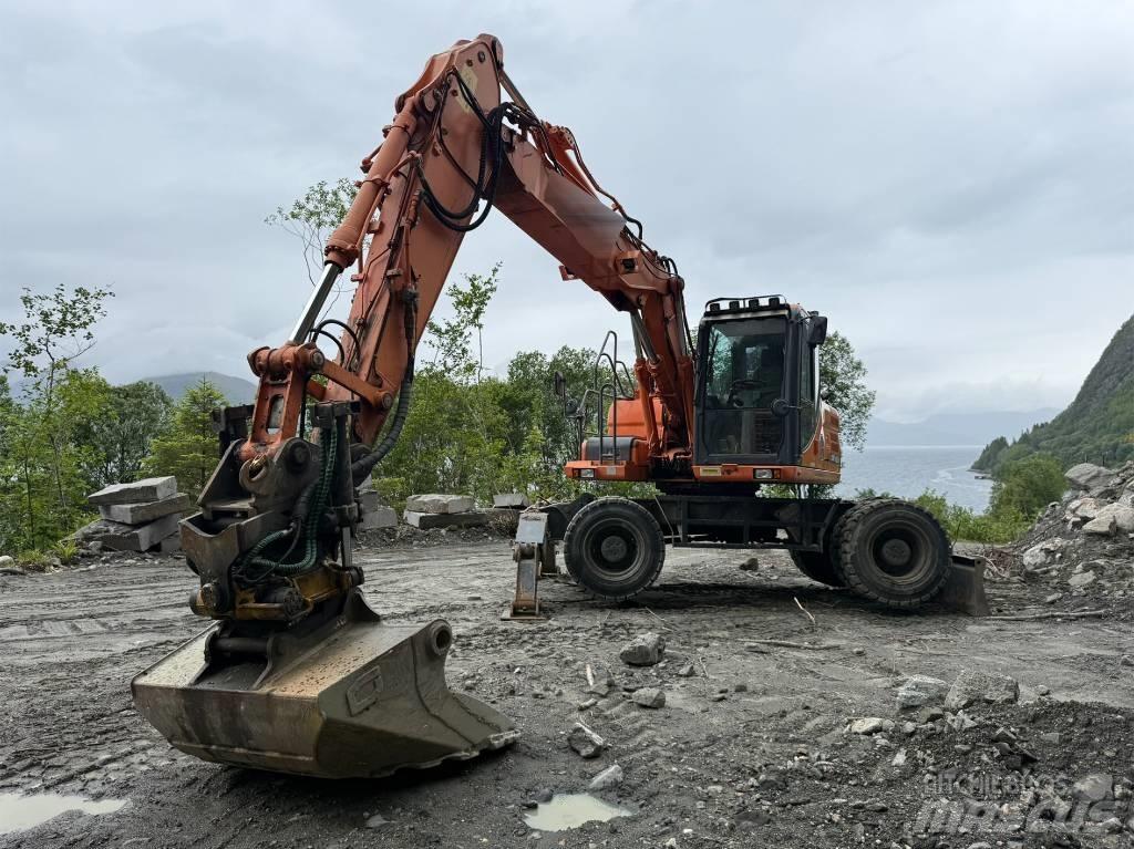 Doosan 140 W حفارات بعجل