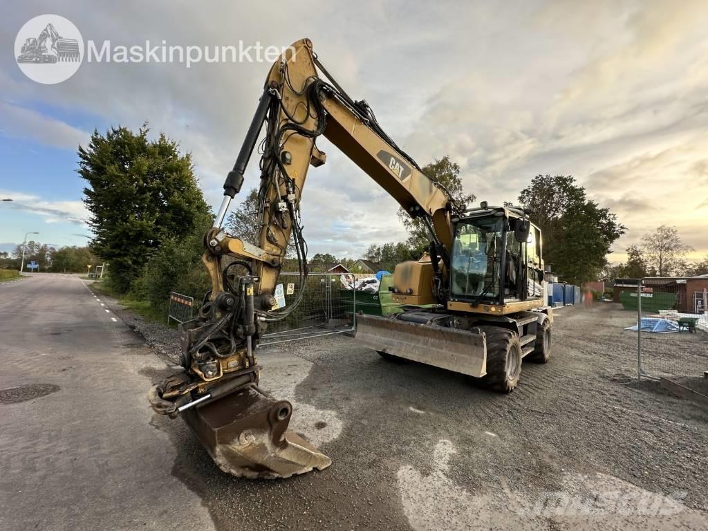 CAT M 317 حفارات بعجل