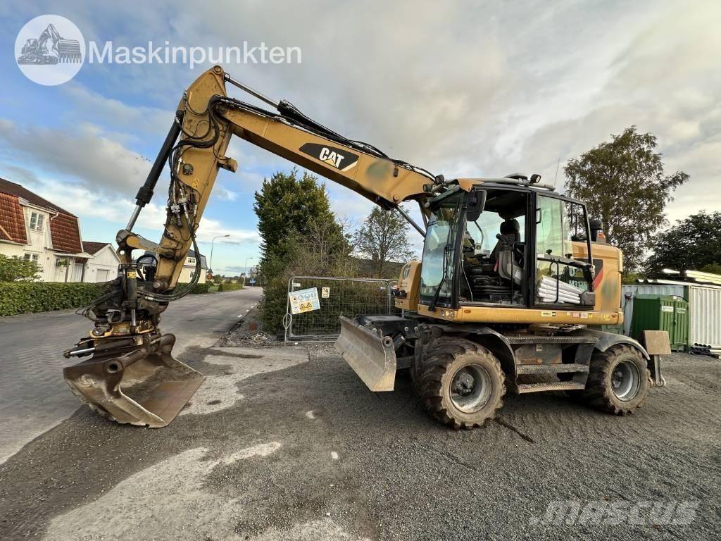CAT M 317 حفارات بعجل