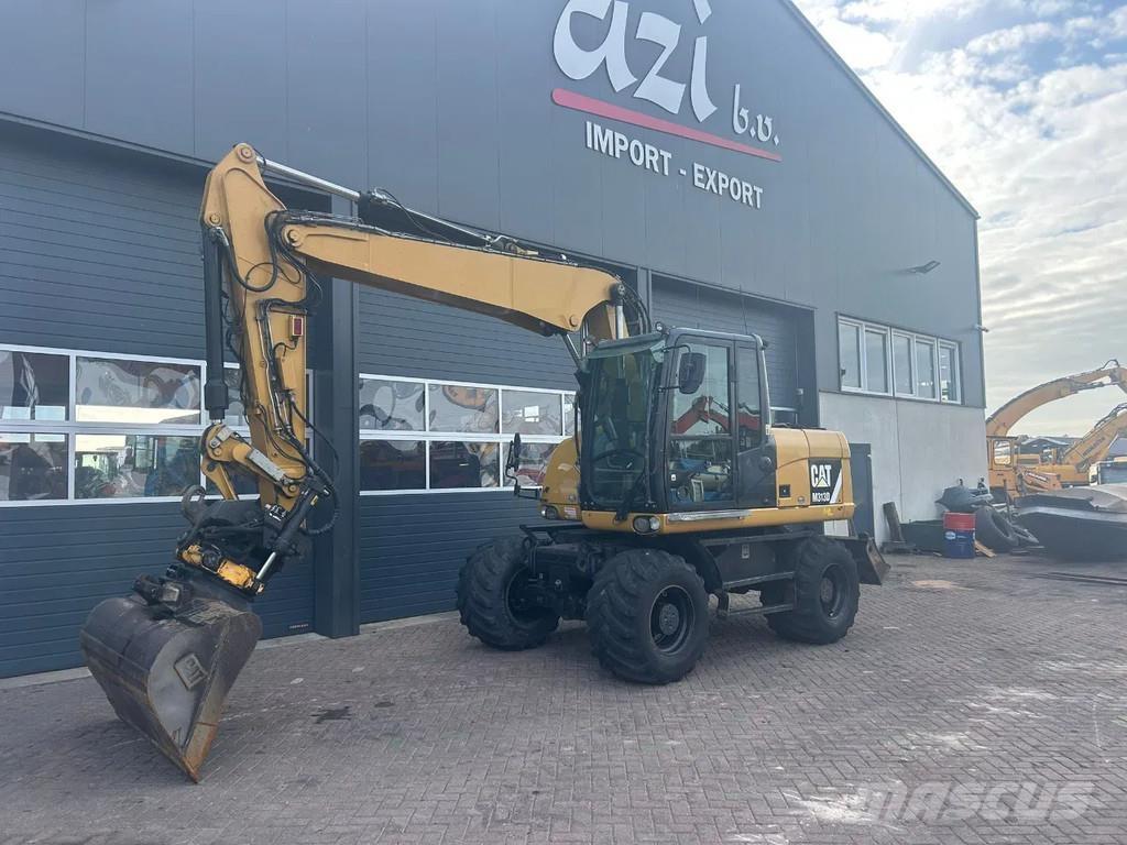 CAT M313D حفارات بعجل